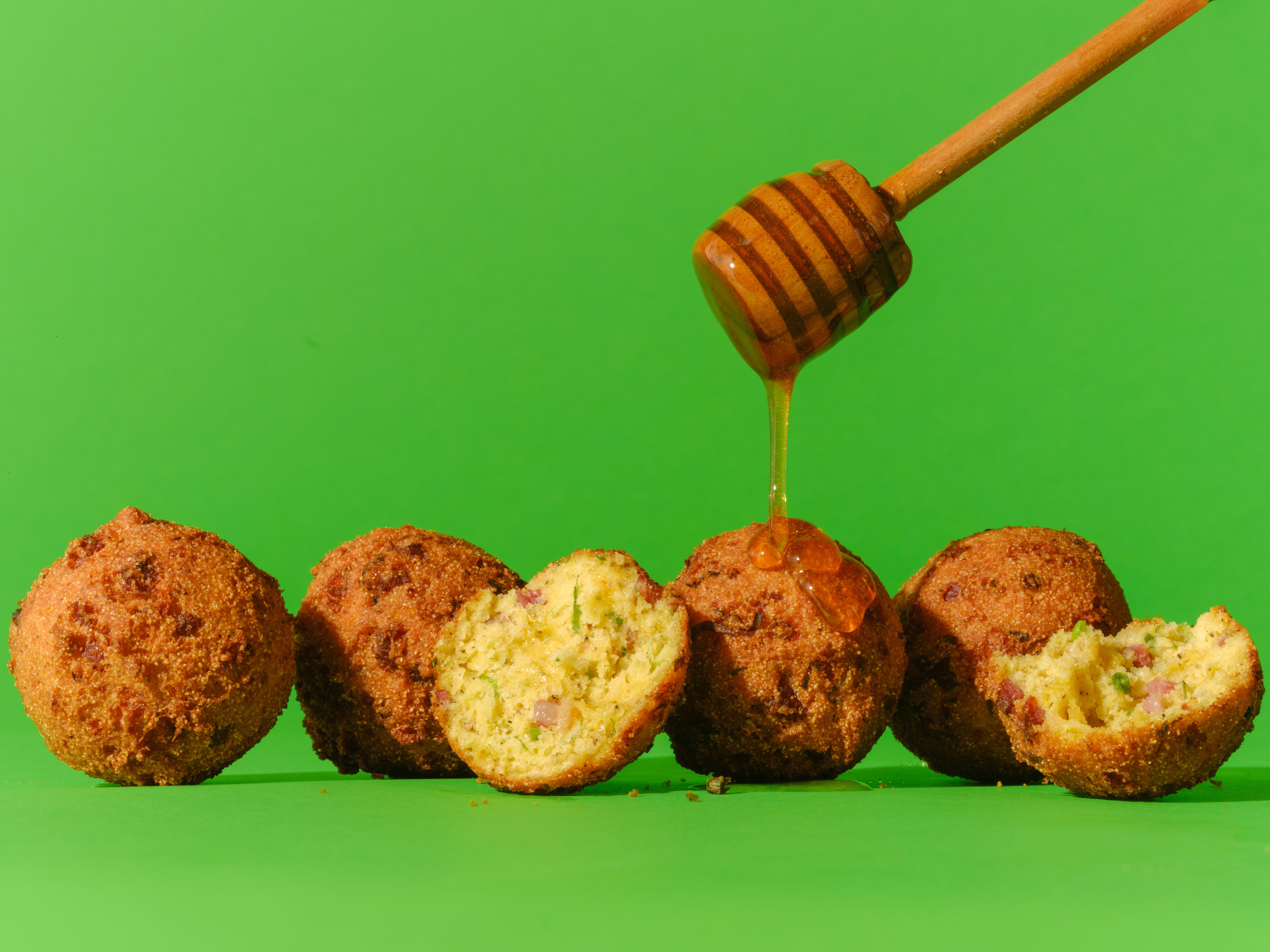 cheddar-tasso-ham-hush-puppies-with-apple-honey__hero-image.jpg