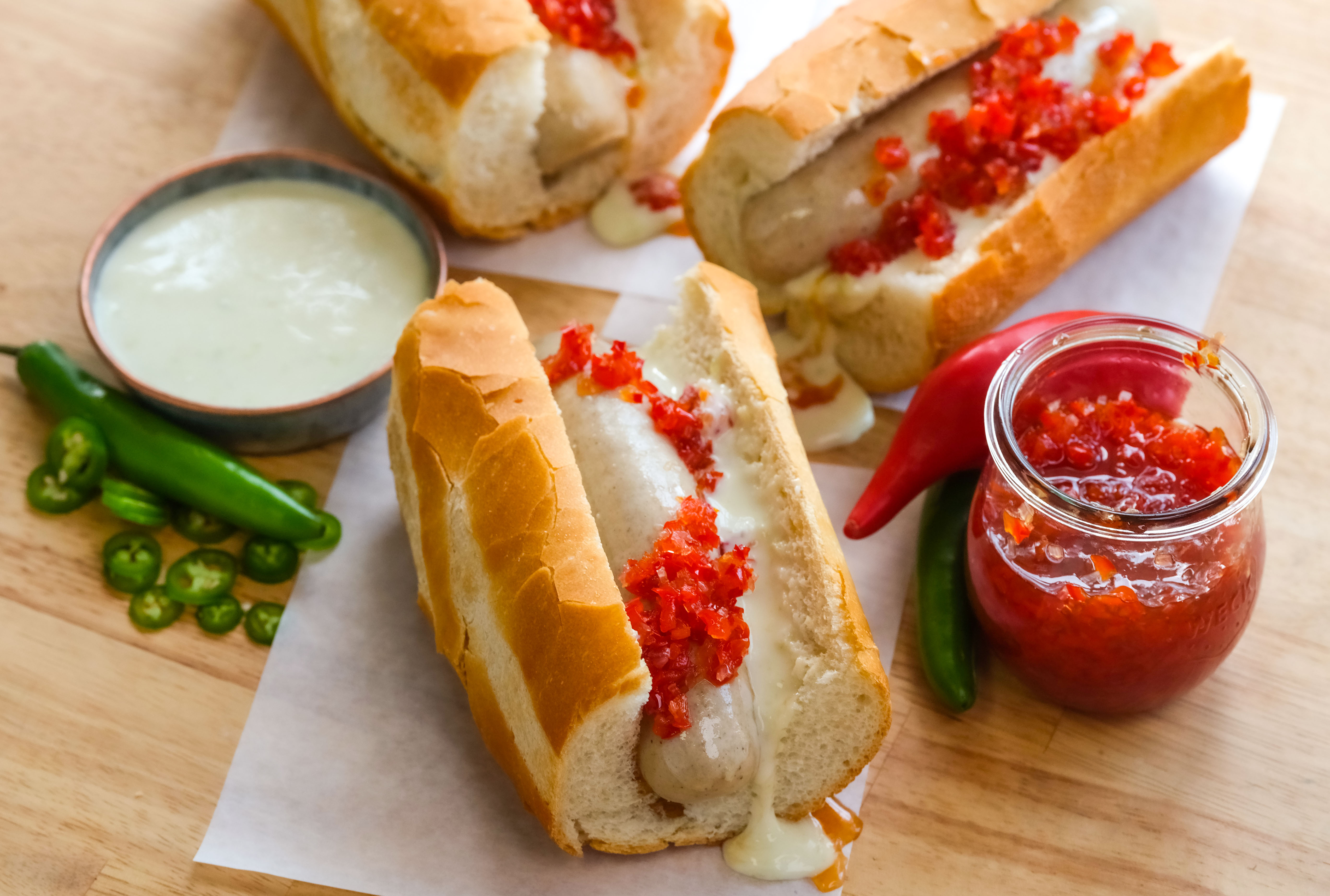sausage-sandwiches-with-serrano-cheese-sauce-and-pepper-relish__hero-image.jpg