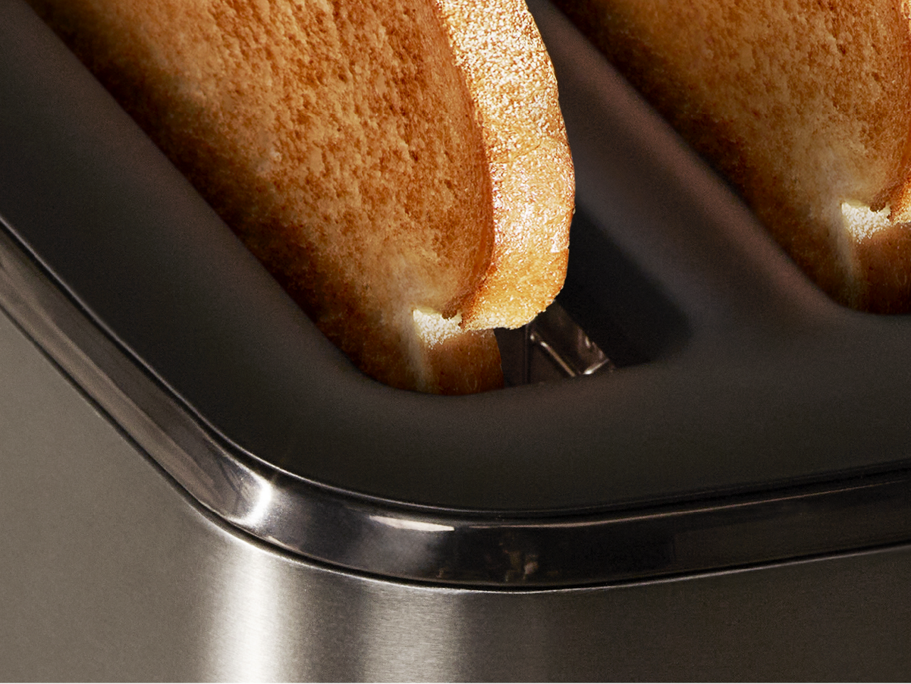 Close-up of slices of golden toast inside the Breville EyeQ toaster.