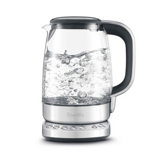 Side view of kettle with water boiling.