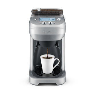 The Grind Control brews directly into short travel mugs.