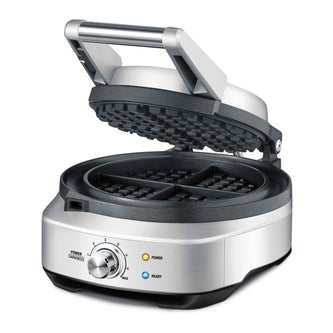 Angled view of opened waffle maker.