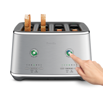 A hand reached out to press a button of the Eye Q™ Auto 4 Slice