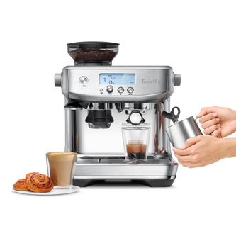 the Barista Pro™ with milk jug, coffee and pastries.