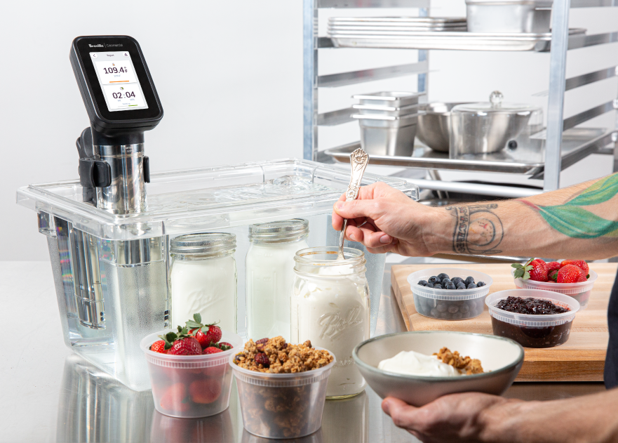 Food in containers sitting in front of sous vide