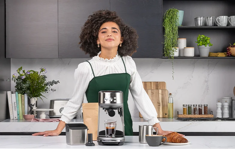 Talented Barista with the Bambino® and barista tool kit ready support your coffee essentials