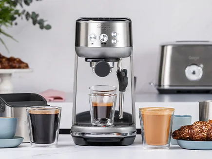 the Bambino® on kitchen bench with latte glasses and barista tool kit