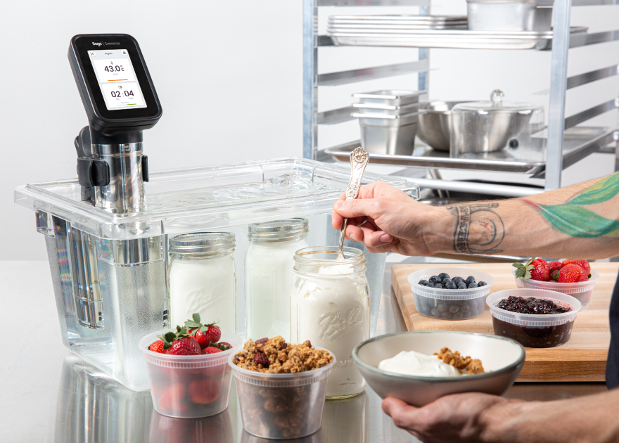 Food in containers sitting in front of sous vide
