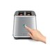 A hand reached out to press a button of the Eye Q™ Auto 2 Slice
