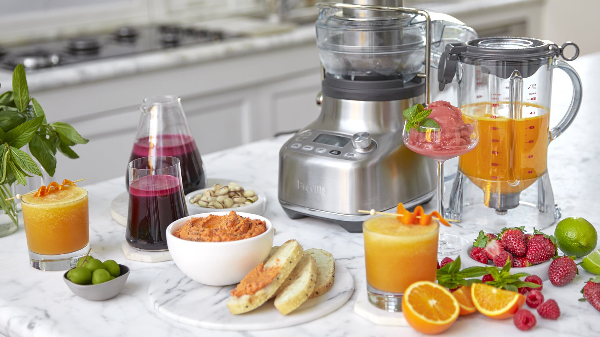 Appliance shown with juices, smoothies, and fresh fruit.