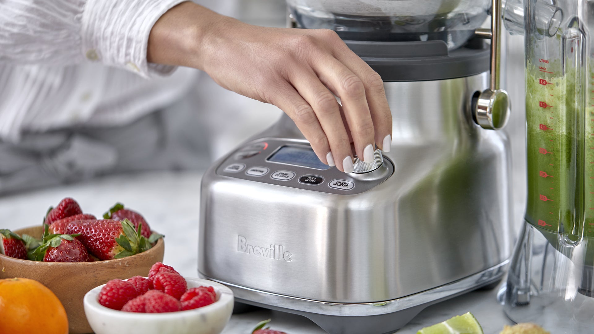 Hand adjusting appliance control dial during use.