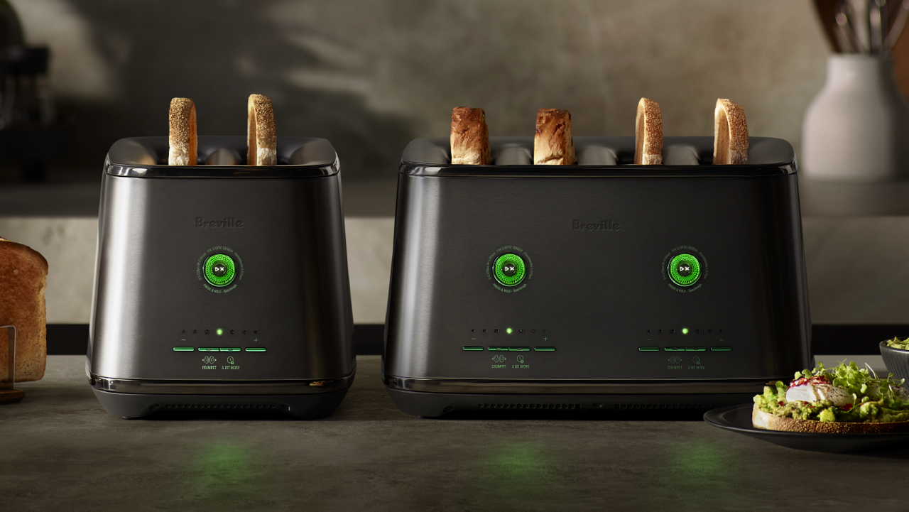 Two Breville EyeQ toasters with toasted bread, displayed on a kitchen counter.