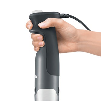 Hand grasping the grip of the product